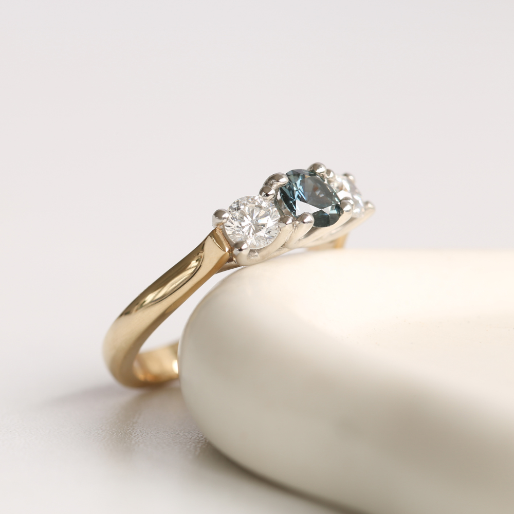 Teal Sapphire and Diamond Three Stone Ring in Gold