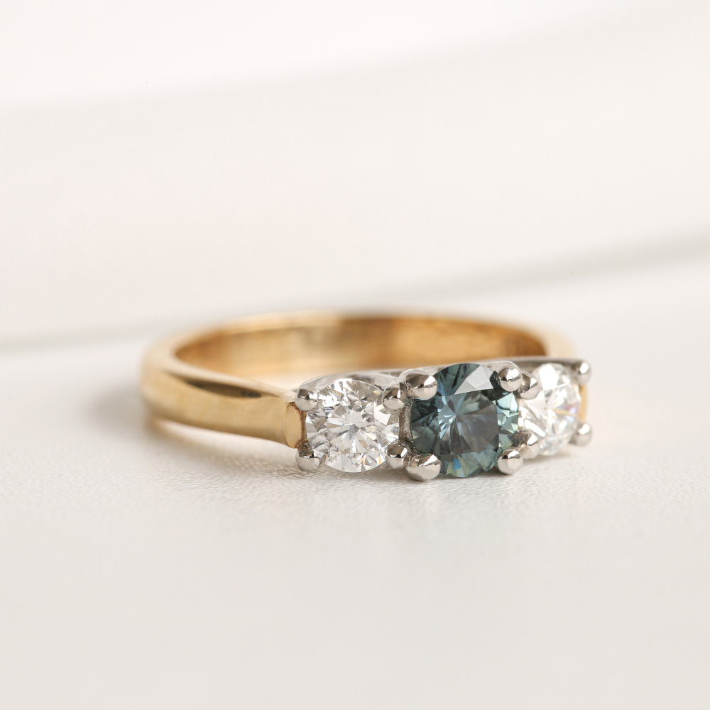 Teal Sapphire and Diamond Three Stone Ring in Gold