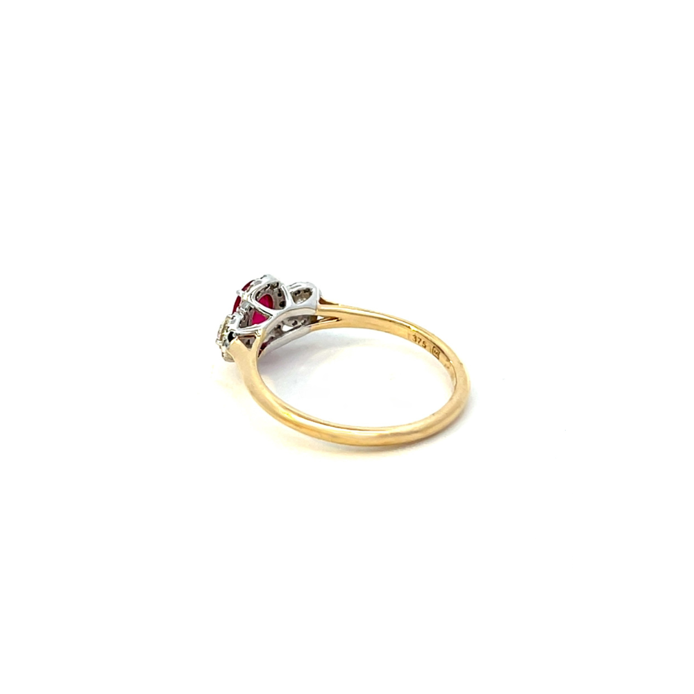 Oval Ruby and Diamond Halo Ring set in Two Tone 9ct Gold