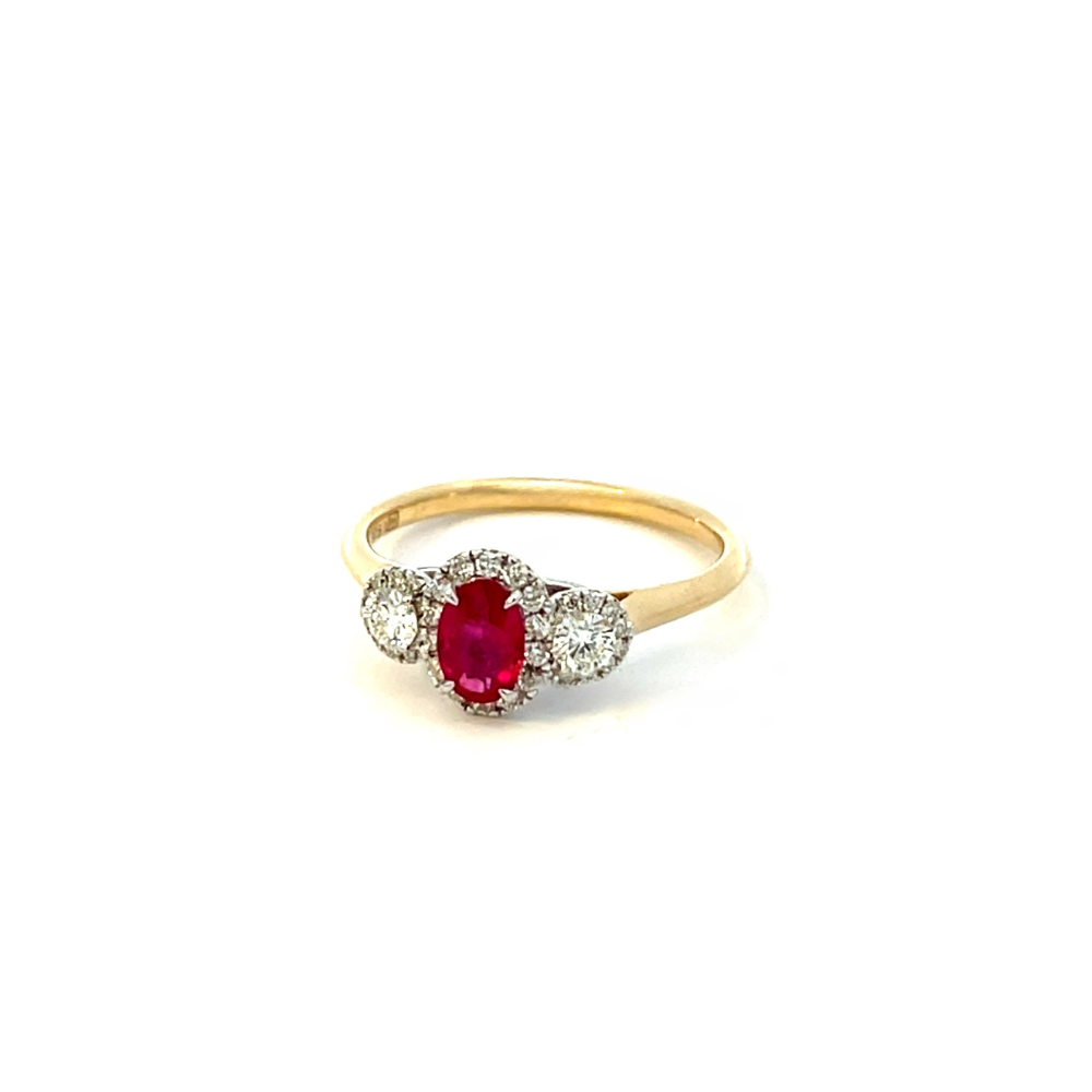 Oval Ruby and Diamond Halo Ring set in Two Tone 9ct Gold