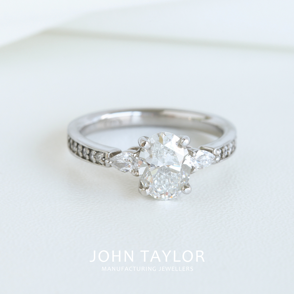 1.55tcw Oval and Pear Diamond Three Stone Ring in Platinum