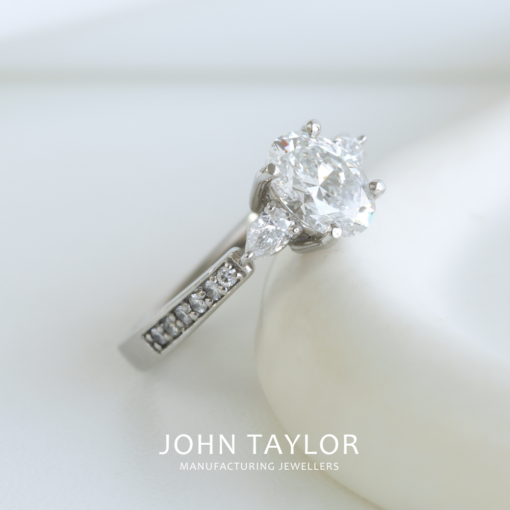 1.55tcw Oval and Pear Diamond Three Stone Ring in Platinum