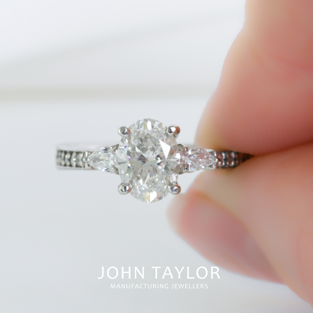 1.55tcw Oval and Pear Diamond Three Stone Ring in Platinum