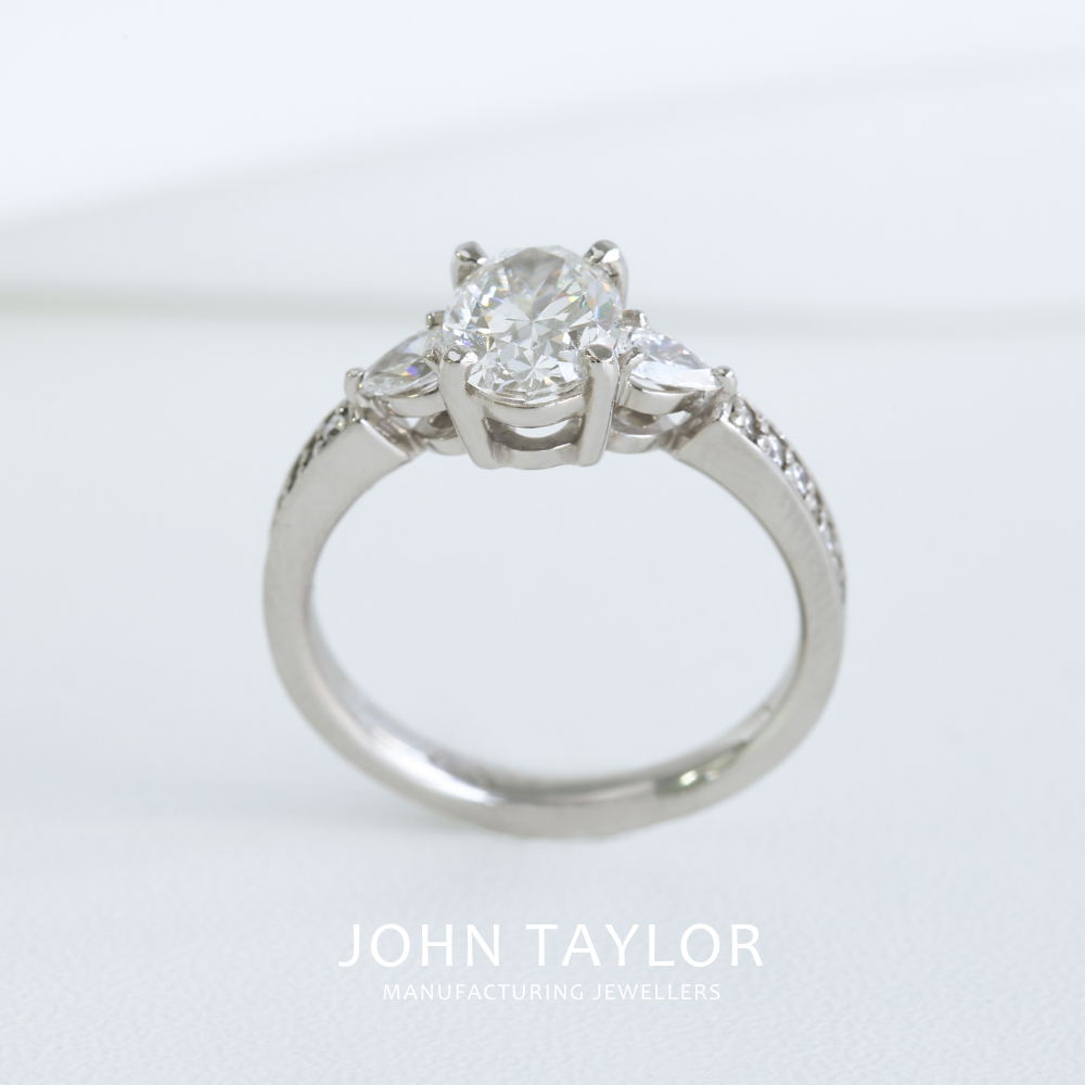 1.55tcw Oval and Pear Diamond Three Stone Ring in Platinum