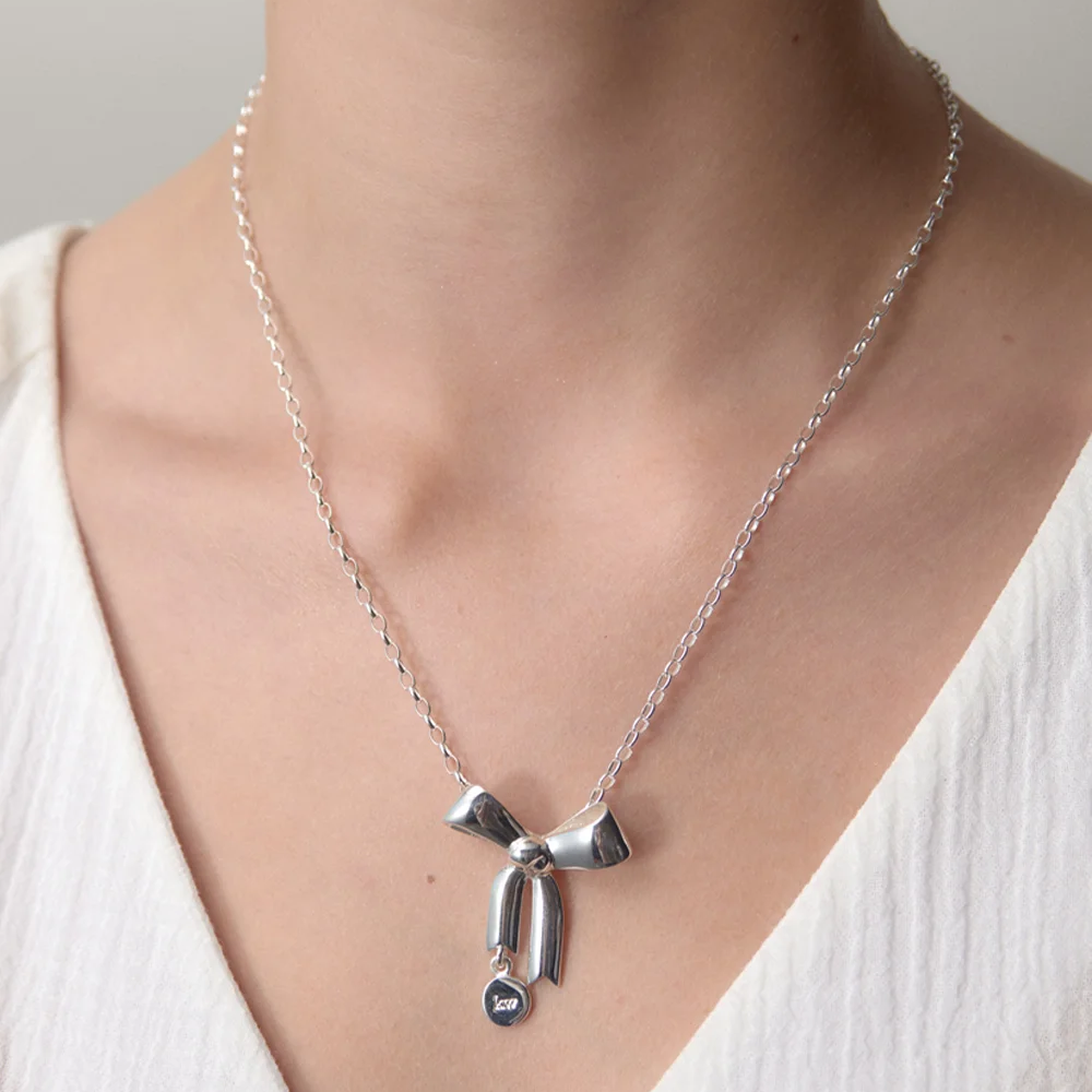 Karen Walker Silver Bow Pendant